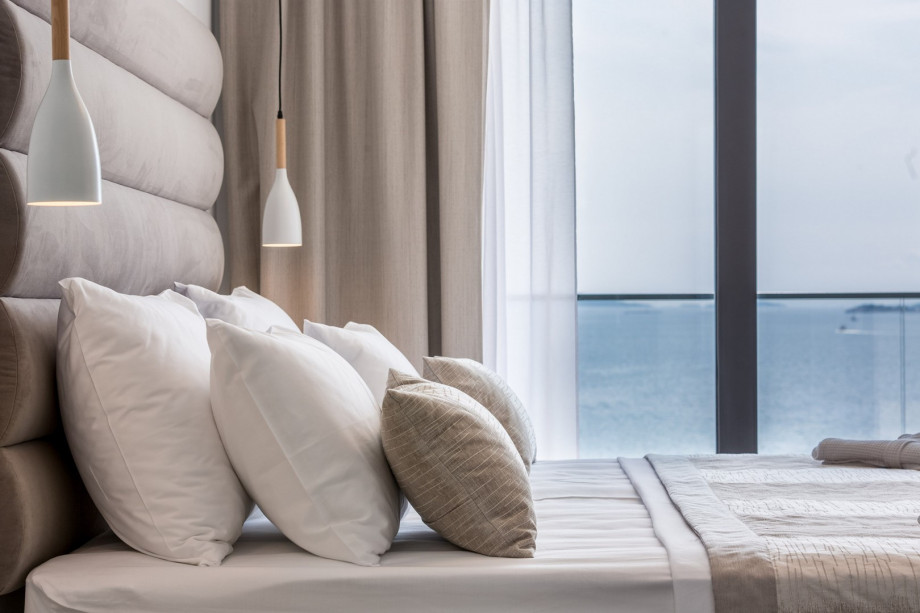 A beautiful bedroom with a sea view.