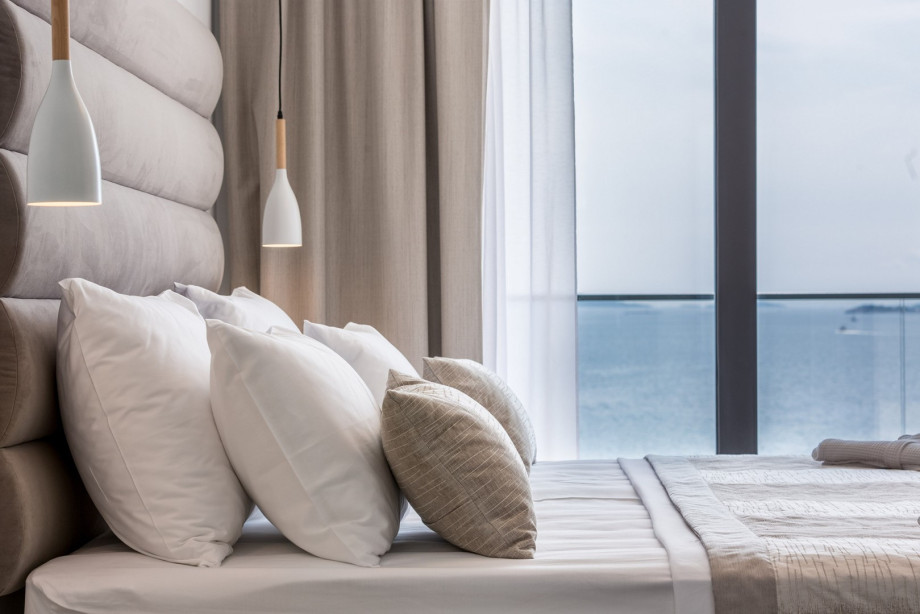 A beautiful bedroom with a sea view.