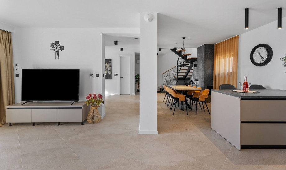 Stylish dining area, and a fireplace with a sofa
