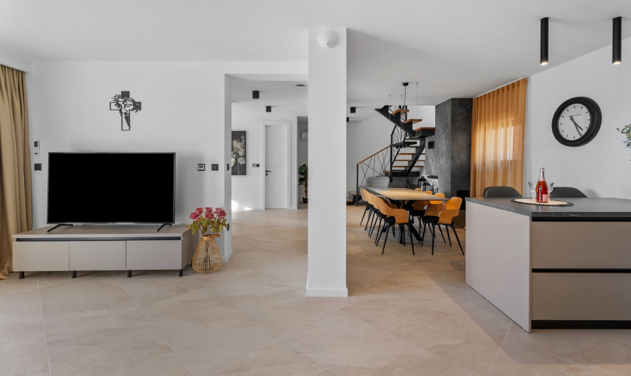 Stylish dining area, and a fireplace with a sofa