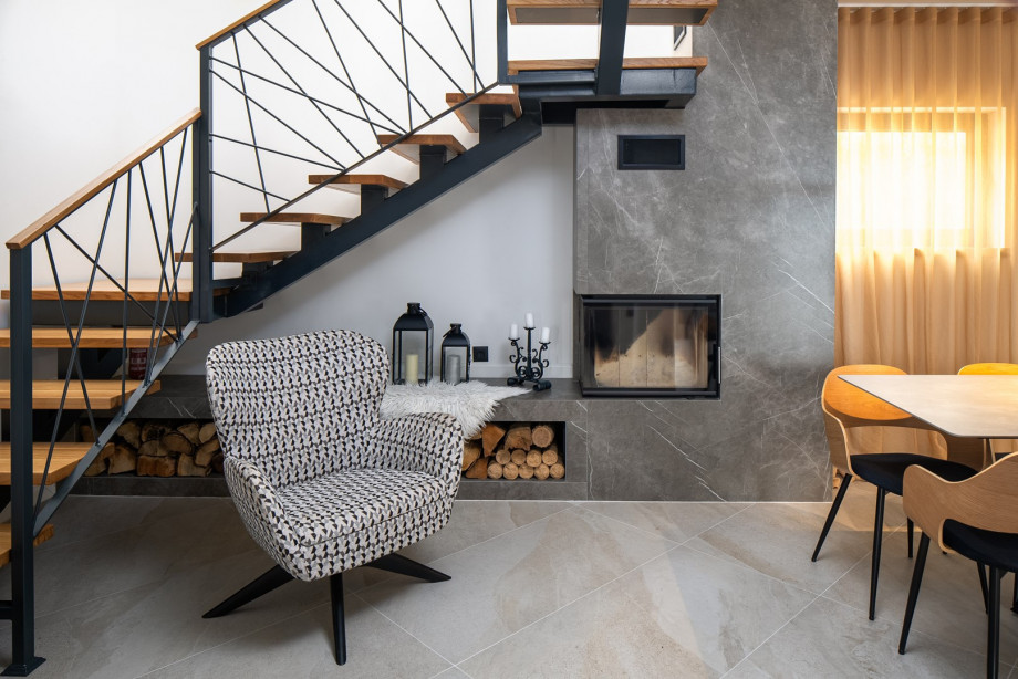 Stylish dining area, and a fireplace with a sofa