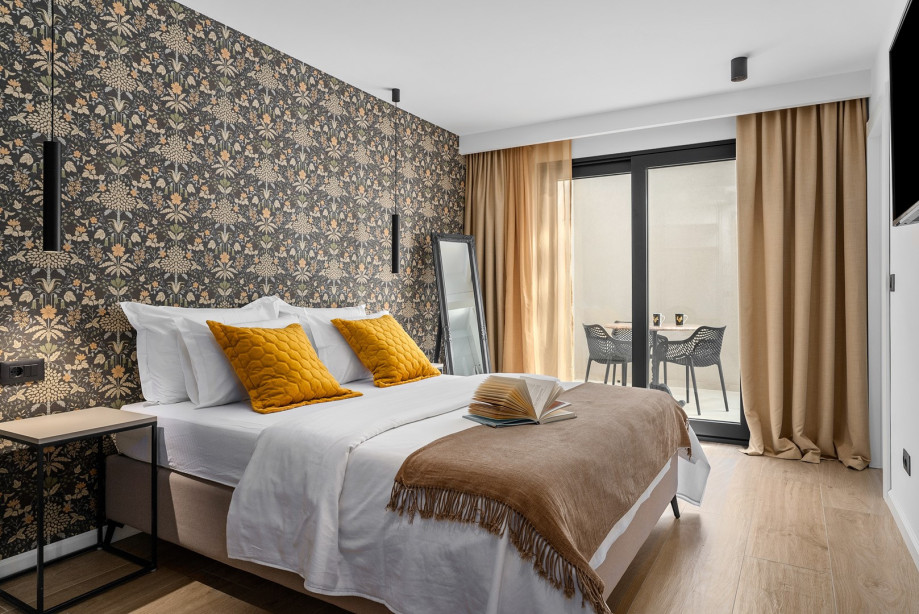 Bedroom NO3 has a queen size bed 160x200cm, TV, AC, en-suite bathroom, and a balcony