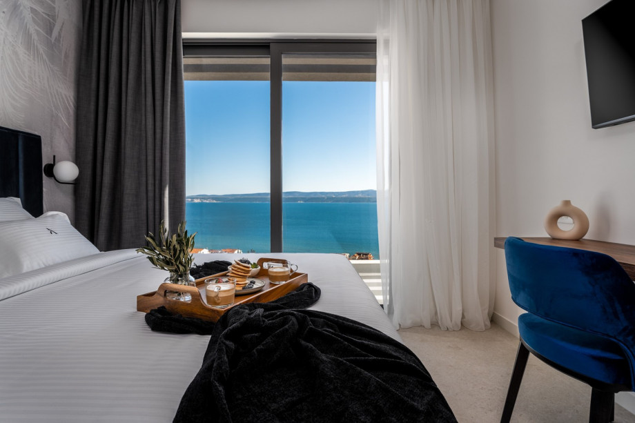 Stylish 4-bedroom villa with en-suite bathrooms, high-end property, and spectacular sea views.