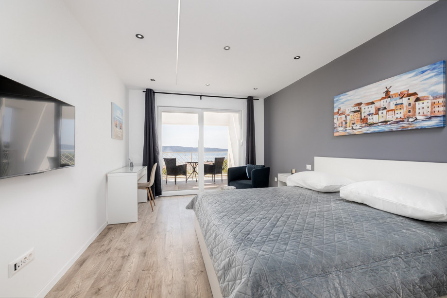 Bedroom No2 with a king size bed, TV, A/C, en-suite bathroom