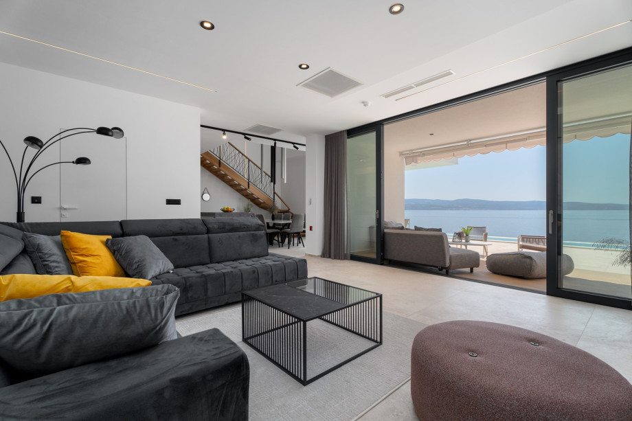 The GROUND floor has an open-plan living area that includes: a fully equipped kitchen (38sqm) with all the amenities a modern guest needs