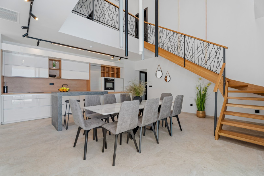 The GROUND floor has an open-plan living area that includes: a fully equipped kitchen (38sqm) with all the amenities a modern guest needs