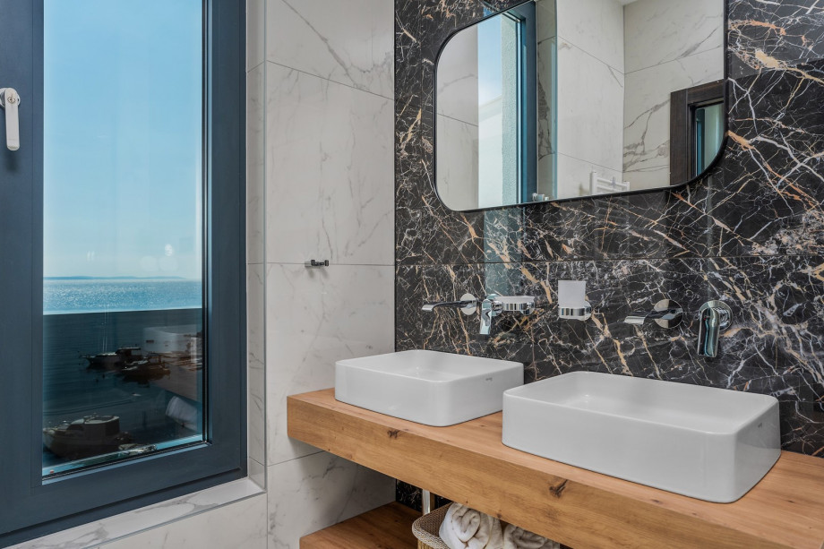 En-suite bathroom with a shower and a sea view