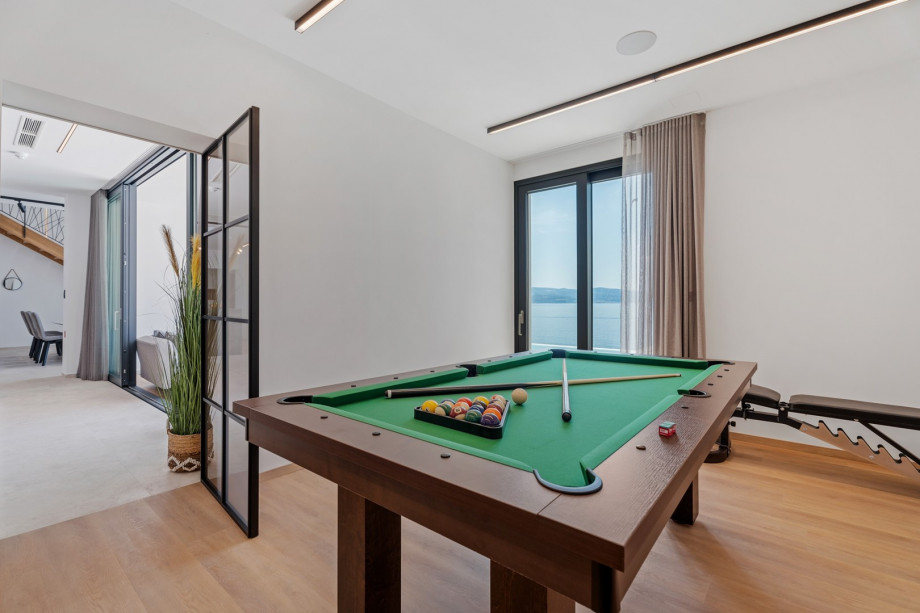 Air-conditioned Gym (22sqm) with a Multipurpose machine, an exercise bike, a Billiard for some fun, a TV, a spacious Finnish sauna, and a shower next to it.