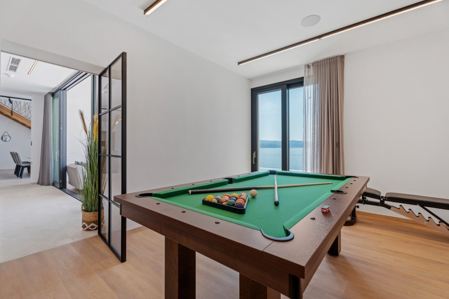 Air-conditioned Gym (22sqm) with a Multipurpose machine, an exercise bike, a Billiard for some fun, a TV, a spacious Finnish sauna, and a shower next to it.