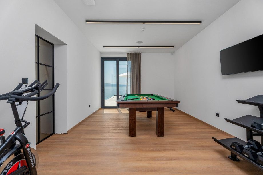 Air-conditioned Gym (22sqm) with a Multipurpose machine, an exercise bike, a Billiard for some fun, a TV, a spacious Finnish sauna, and a shower next to it.