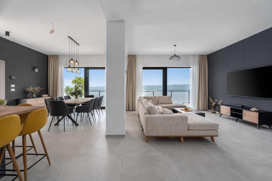 A fully air-conditioned 4-bedroom villa with free WiFi, spacious living area, fully equipped kitchen, a charming outdoor dining area and lounge corner,