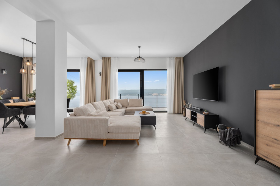 The living room with a very comfortable sofa, a flat screen TV, Netflix, Play Station 4.