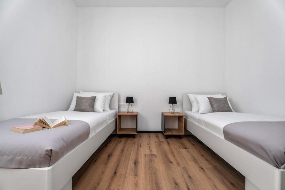 Bedroom NO3 (12sqm) with two single beds 90cm x 200cm, TV, A/C, views of the pool area on the west side.