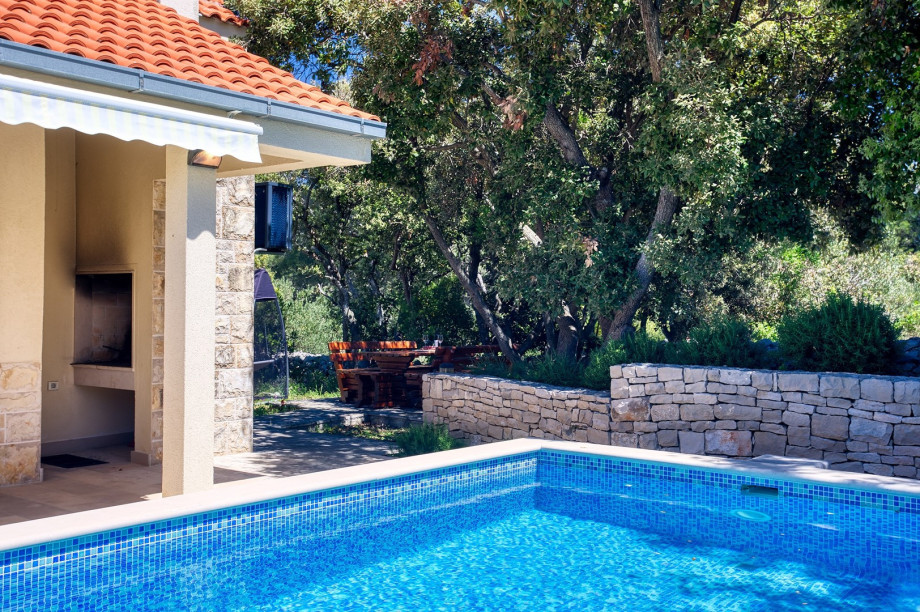 Outdoor dining area with a traditional barbecue