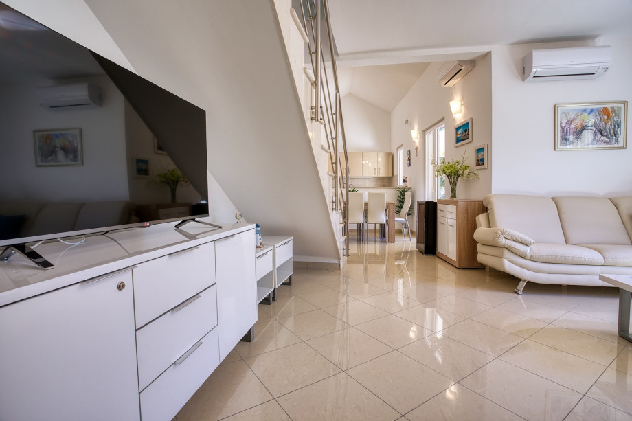 The ground floor level offers a family bathroom with a shower