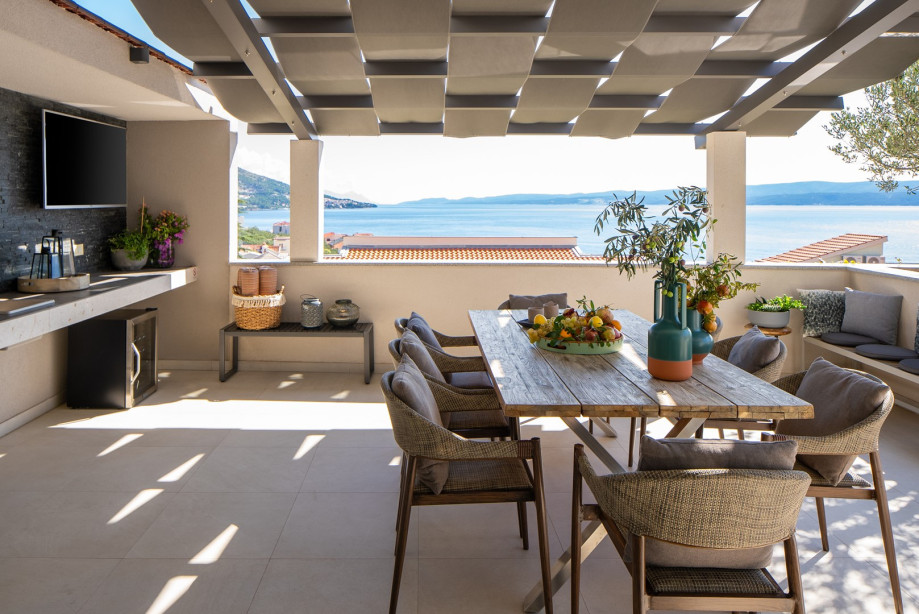 Covered outdoor dining area with an amazing sea view