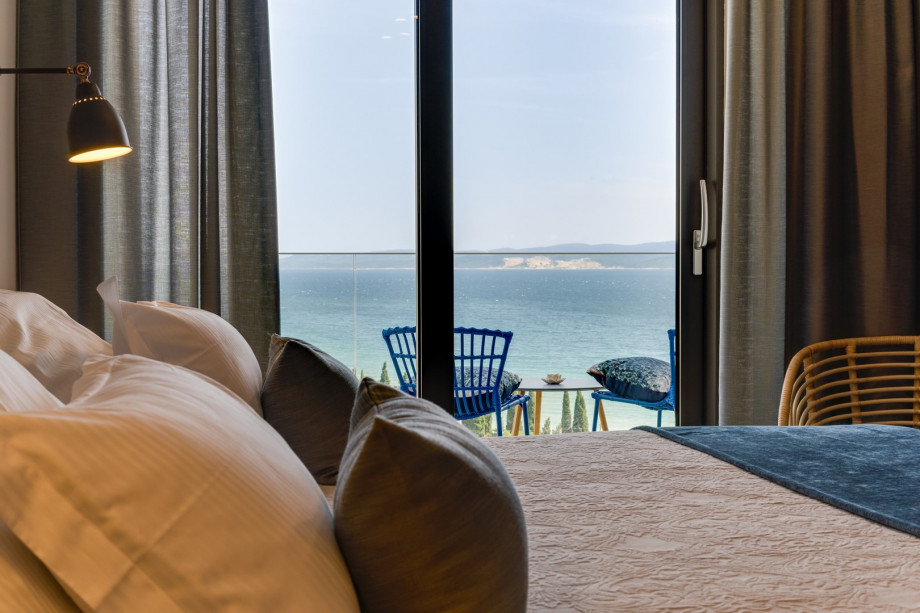 Bedroom No1 with a king-size bed 180x200cm, TV, A/C, en-suite bathroom with a shower, and a balcony