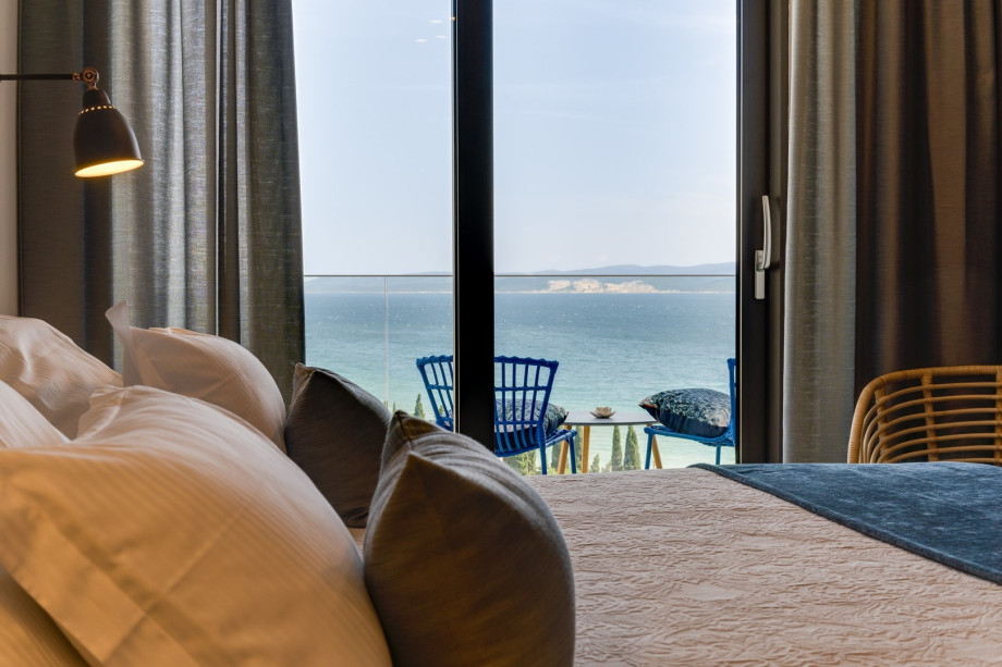 Bedroom No1 with a king-size bed 180x200cm, TV, A/C, en-suite bathroom with a shower, and a balcony