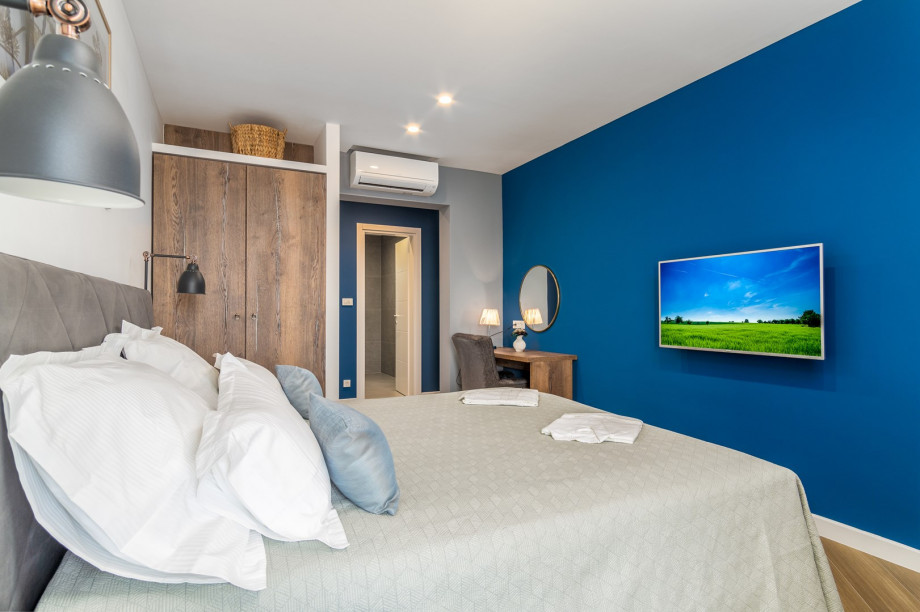 Bedroom No2 with a king-size bed 180 x 200cm, TV, A/C, en-suite bathroom with a shower, a balcony