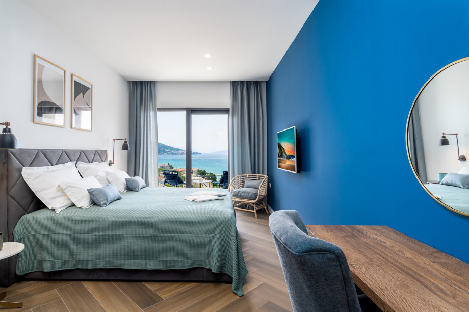 Bedroom No3 with a king-size bed 180x200cm, TV, A/C, en-suite bathroom with a shower, and a balcony