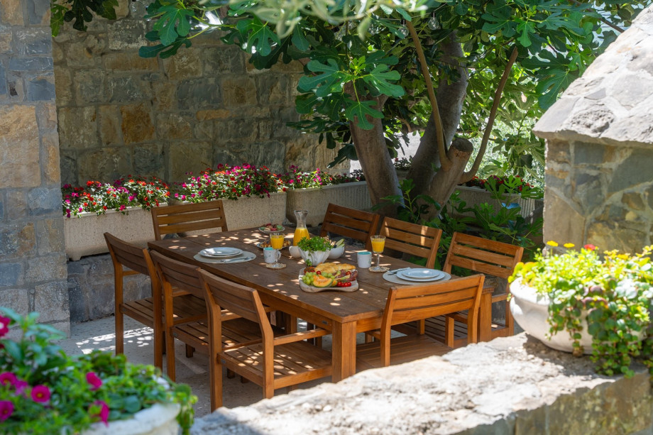 Beautiful outdoor dining area in natural shadow