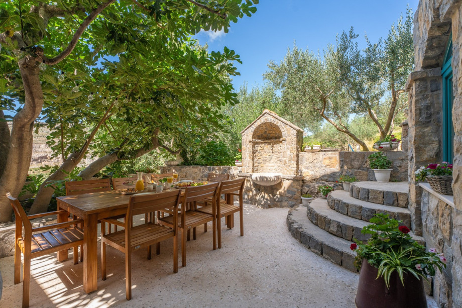 Beautiful outdoor dining area in natural shadow