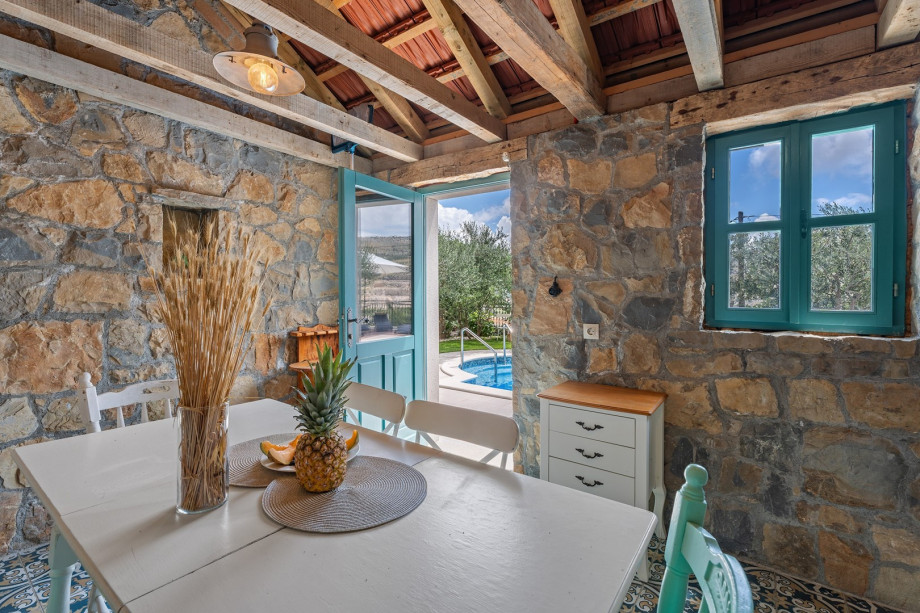 Summer kitchen with traditional grill next to the pool