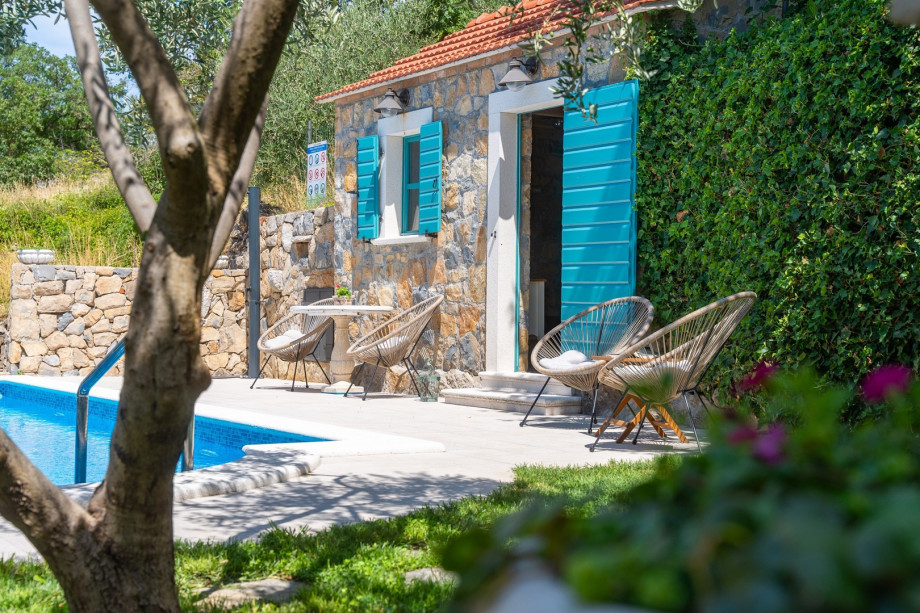Enjoy privacy at pool area and summer kitchen