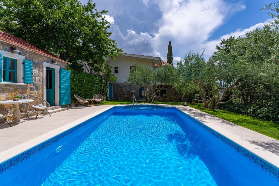 Enjoy privacy at the pool area and summer kitchen