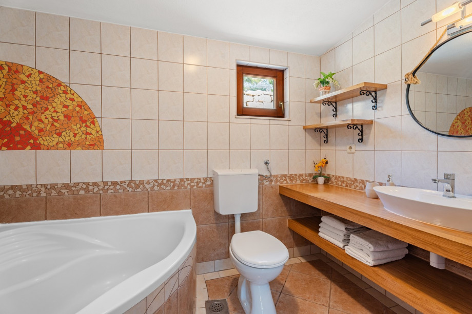 Family bathroom with a tub