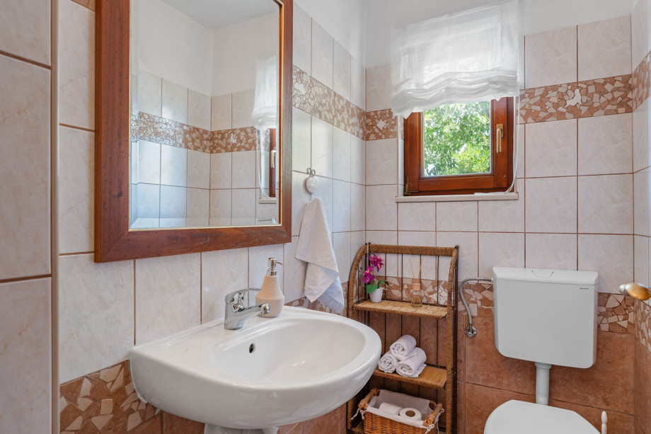 Toilet in the hall next to the living area