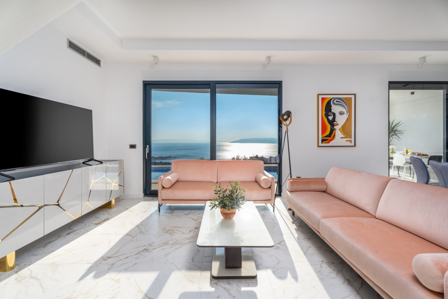 A spacious and stylish living room with comfortable sofas.