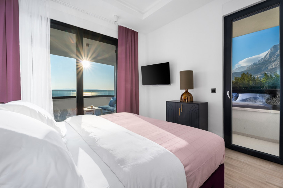 Bedroom No. 2 with a sea view, an  A/C, TV, and an en-suite bathroom.