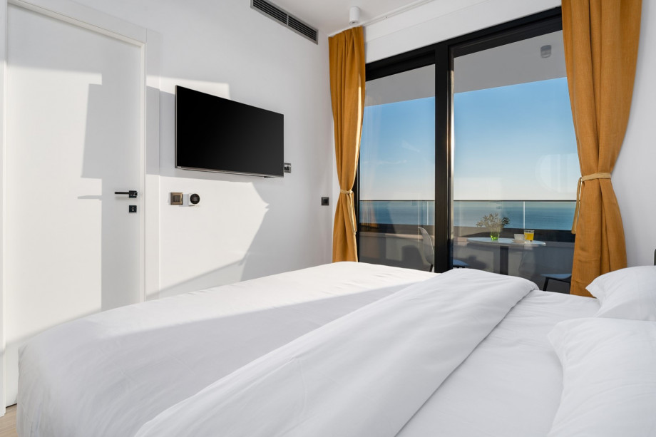 Bedroom No. 3 with a balcony, and an en-suite bathroom.