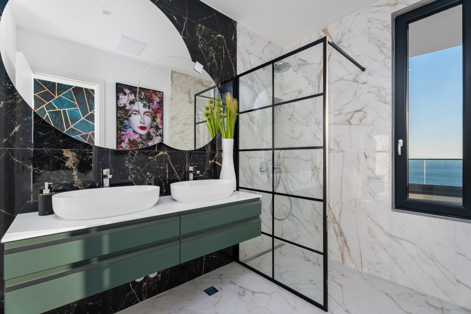 En-suite bathroom with a shower, and amazing sea views.