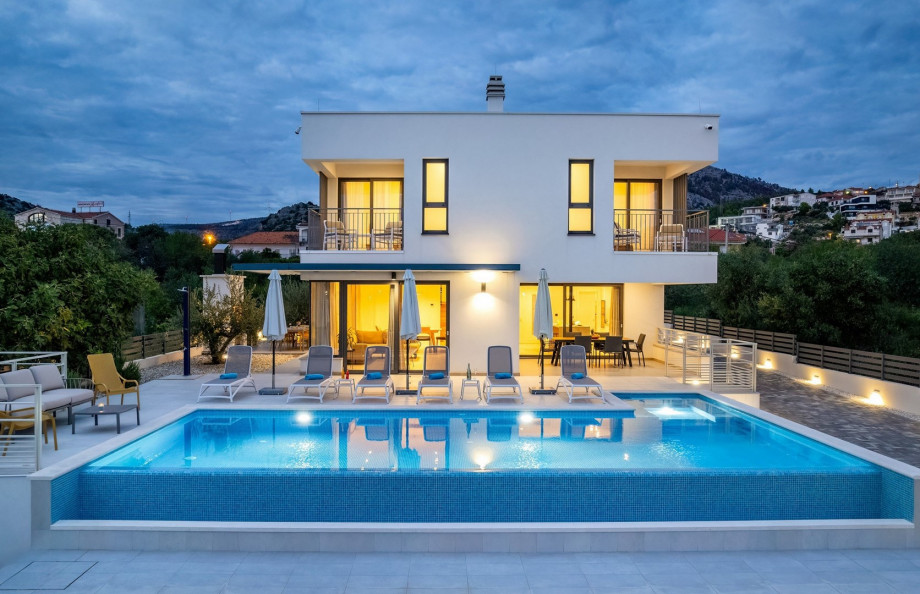 Pool area with carefully set lights for cozy evenings in quiet area