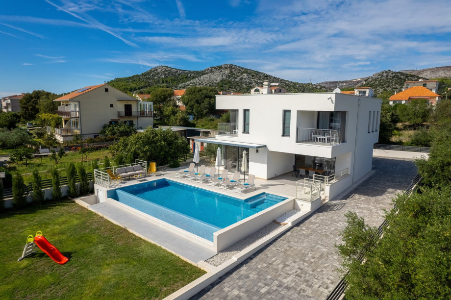 A grassy area with a slide for your youngest