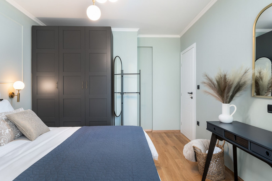 The second bedroom features a king-size bed