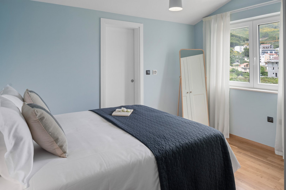 The first bedroom on second floor has an attached bathroom with a shower