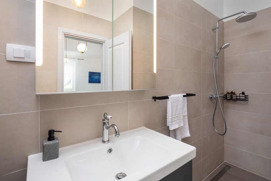 An en-suite bathroom with a shower
