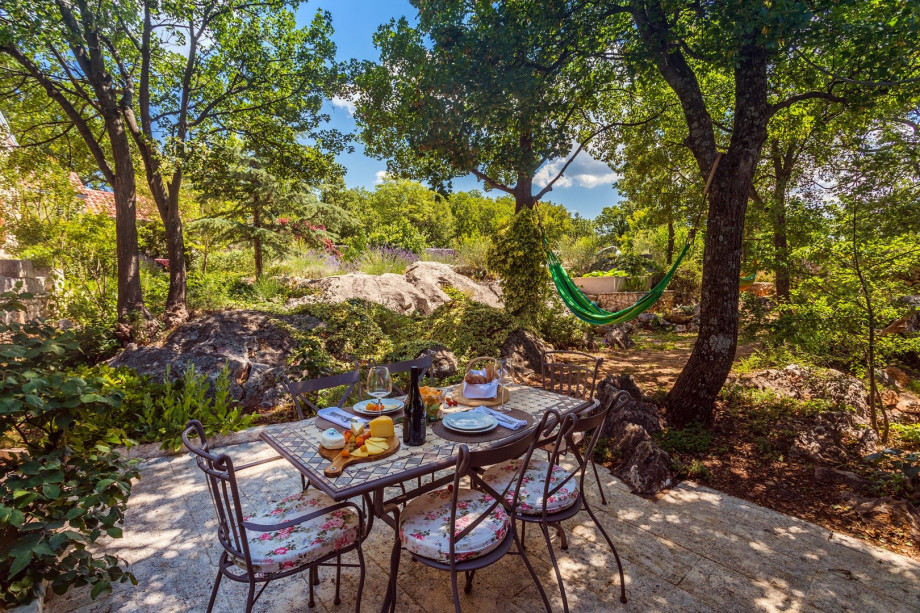 Out door dining area next to the kitchen and BBQ
