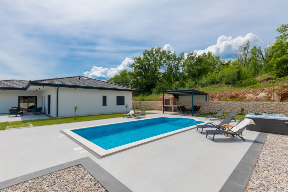 A relaxing area by the pool with a panoramic view