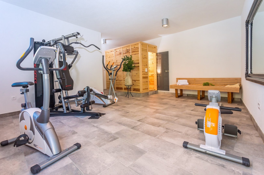 Finnish sauna, A/C, equipment for training, few steps down from pool area