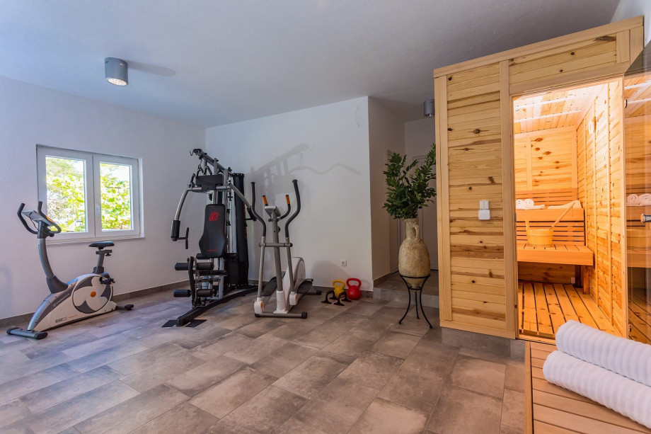 Finnish sauna, A/C, equipment for training, few steps down from pool area