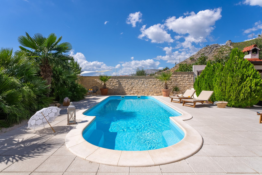 32 square meters pool, with 8 deck chairs