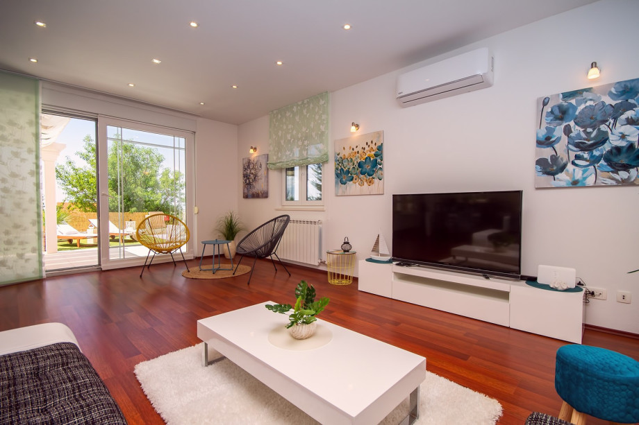 air-conditioned living and dining area with a fully equipped kitchen