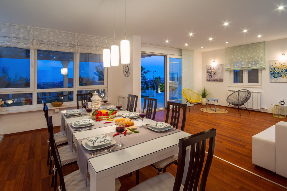 air-conditioned living and dining area with a fully equipped kitchen