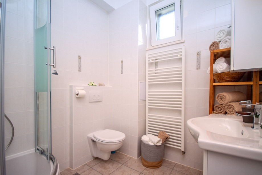 a family bathroom with a shower
