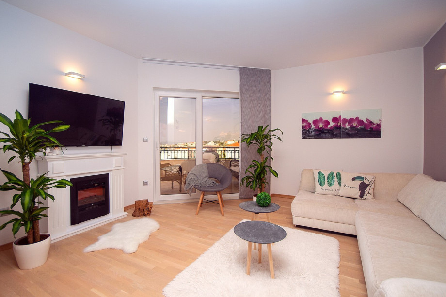 air-conditioned living and dining area with a fully equipped kitchen