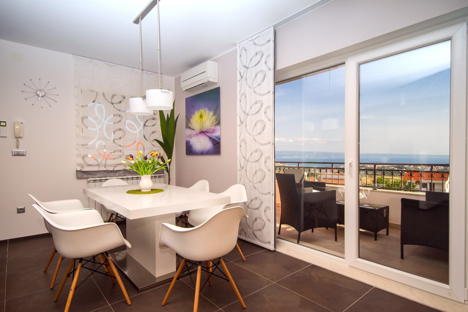 air-conditioned living and dining area with a fully equipped kitchen